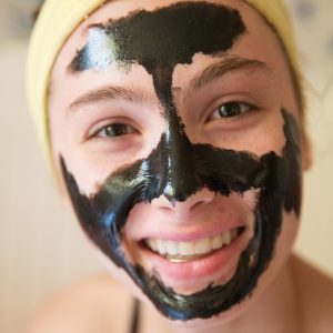 Teenage girl with detoxifying mask