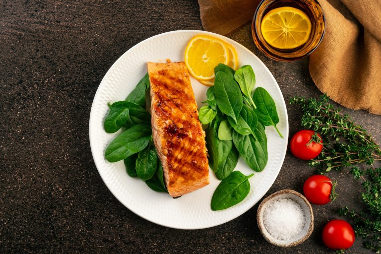 Baked or fried salmon and salad, Paleo, keto, fodmap, dash diet. Mediterranean food with steamed