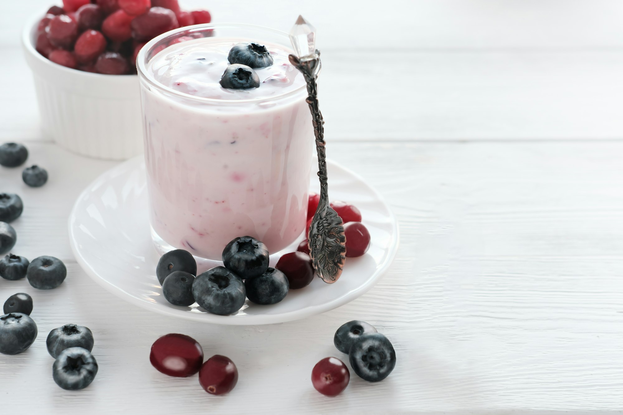 homemade yogurt with berries in a glass. blueberries and cranberry